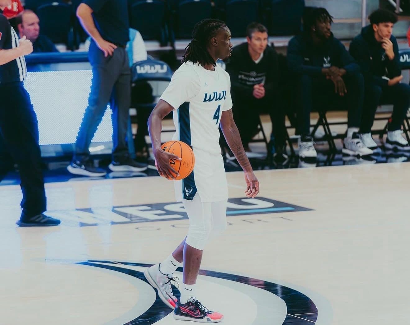 Mo Niang with the ball during a college game